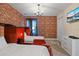 Train-themed bedroom with two twin beds and brick feature wall at 4575 Narrative Ln, Kissimmee, FL 34746