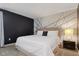 Main bedroom with a large bed and accent wall at 4575 Narrative Ln, Kissimmee, FL 34746