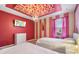 Charming bedroom with a flower ceiling, princess theme, and two twin beds at 4575 Narrative Ln, Kissimmee, FL 34746