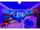 ' bedroom with bunk beds, slide, and futuristic decor at 4575 Narrative Ln, Kissimmee, FL 34746