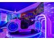 Themed bedroom with a ride-on toy and large screen at 4575 Narrative Ln, Kissimmee, FL 34746