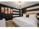 Bedroom with black and white striped walls and a king-size bed at 4575 Narrative Ln, Kissimmee, FL 34746