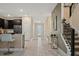 Spacious entryway with tile flooring and a view into the kitchen at 4575 Narrative Ln, Kissimmee, FL 34746