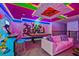 Game room with air hockey and Marvel character wall art at 4575 Narrative Ln, Kissimmee, FL 34746
