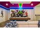 Game room with air hockey and Marvel comic wall art at 4575 Narrative Ln, Kissimmee, FL 34746