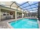 Relaxing screened pool and spa with patio furniture at 4575 Narrative Ln, Kissimmee, FL 34746