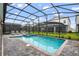 Screened pool and spa with patio lounge chairs at 4575 Narrative Ln, Kissimmee, FL 34746