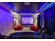 Home theater with projector, screen, and beanbag chairs at 4575 Narrative Ln, Kissimmee, FL 34746