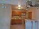 Traditional kitchen features classic wood cabinets and tiled countertops at 4824 Shoshone St, Orlando, FL 32819