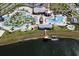 Aerial view of community pool, clubhouse, and lake at 4902 Windermere Ave, Kissimmee, FL 34746