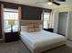 Spacious bedroom with a king-size bed and ample natural light at 4902 Windermere Ave, Kissimmee, FL 34746