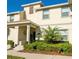 Two-story townhome with attractive landscaping and a welcoming entrance at 4902 Windermere Ave, Kissimmee, FL 34746