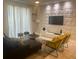 Modern living room with stylish furniture and a unique wall feature at 4902 Windermere Ave, Kissimmee, FL 34746