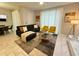 Open living area with comfortable seating and large windows at 4902 Windermere Ave, Kissimmee, FL 34746