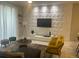 Modern living room with stylish furniture and a unique wall feature at 4902 Windermere Ave, Kissimmee, FL 34746
