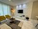 Modern living room with stylish furniture and a unique wall accent at 4902 Windermere Ave, Kissimmee, FL 34746