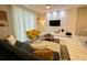 Modern living room with stylish furniture and a unique wall accent at 4902 Windermere Ave, Kissimmee, FL 34746