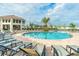 Relaxing community pool with many lounge chairs at 4902 Windermere Ave, Kissimmee, FL 34746