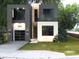 Modern two-story home with attached garage and sleek design at 5151 Marina Dr, St Cloud, FL 34771