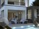 Relaxing poolside patio with outdoor kitchen and seating area at 5151 Marina Dr, St Cloud, FL 34771