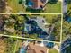 Aerial view of house, pool, and surrounding landscape at 5666 Merlin Way, St Cloud, FL 34772