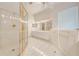 Bathroom with walk-in shower and bathtub at 5666 Merlin Way, St Cloud, FL 34772