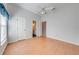 Bedroom featuring wood floors and access to bathroom at 5666 Merlin Way, St Cloud, FL 34772
