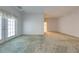 Bright bedroom with doors leading to outside at 5666 Merlin Way, St Cloud, FL 34772