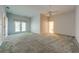 Primary bedroom with carpet and French doors at 5666 Merlin Way, St Cloud, FL 34772