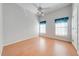 Bedroom with light wood flooring and ceiling fan at 5666 Merlin Way, St Cloud, FL 34772