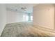 Spacious Primary bedroom with carpet and ceiling fan at 5666 Merlin Way, St Cloud, FL 34772