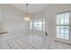 Breakfast nook with bay window and chandelier at 5666 Merlin Way, St Cloud, FL 34772