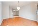 Bright dining room with hardwood floors and a chandelier at 5666 Merlin Way, St Cloud, FL 34772
