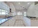 Kitchen with granite counters and white cabinets at 5666 Merlin Way, St Cloud, FL 34772