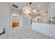Kitchen features white cabinets and an island at 5666 Merlin Way, St Cloud, FL 34772