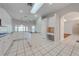Spacious kitchen with island and white cabinets at 5666 Merlin Way, St Cloud, FL 34772