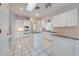 Kitchen boasts white cabinets and granite counters at 5666 Merlin Way, St Cloud, FL 34772