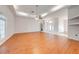 Spacious living room with hardwood floors and fireplace at 5666 Merlin Way, St Cloud, FL 34772
