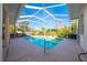 Screened-in pool area with a large, inviting pool at 5666 Merlin Way, St Cloud, FL 34772