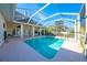 Inviting screened pool with a large patio and home view at 5666 Merlin Way, St Cloud, FL 34772