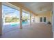 Covered patio overlooking a refreshing pool at 5666 Merlin Way, St Cloud, FL 34772