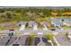 Aerial view of a street lined with houses, showcasing the community's uniformity and landscaping at 1067 Haines Dr, Winter Haven, FL 33881