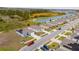 Aerial view of a new housing development featuring numerous homes and a serene waterway at 1067 Haines Dr, Winter Haven, FL 33881