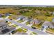 Aerial view of a residential street with houses featuring solar panels and ample parking at 1067 Haines Dr, Winter Haven, FL 33881