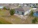 Backyard view of a house showing a small patio and unlandscaped area at 1067 Haines Dr, Winter Haven, FL 33881