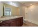 Clean bathroom with shower/tub combo and wood vanity at 1067 Haines Dr, Winter Haven, FL 33881