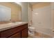 Bathroom with tub, wood vanity and tile flooring at 1067 Haines Dr, Winter Haven, FL 33881