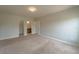 Bright bedroom featuring neutral walls, carpet, and ensuite bathroom at 1067 Haines Dr, Winter Haven, FL 33881