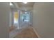 Bright and spacious entryway with neutral colored carpet and open floor plan at 1067 Haines Dr, Winter Haven, FL 33881