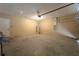 Garage with overhead door, concrete floor, and ample storage at 1067 Haines Dr, Winter Haven, FL 33881
